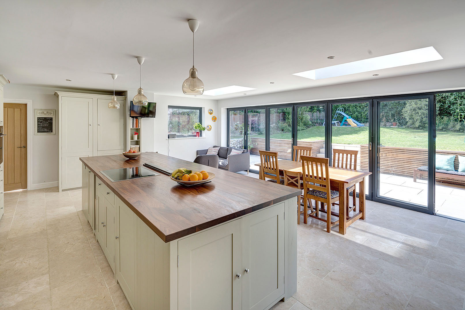 a large open-plan kitchen and dining area with a better connection to the garden.