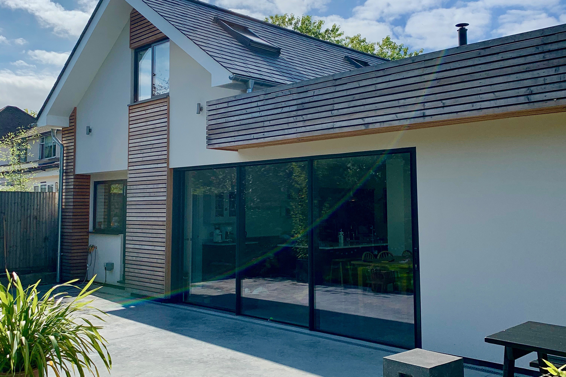 A double-storey side extension and single-storey rear addition introduce generous open-plan living spaces