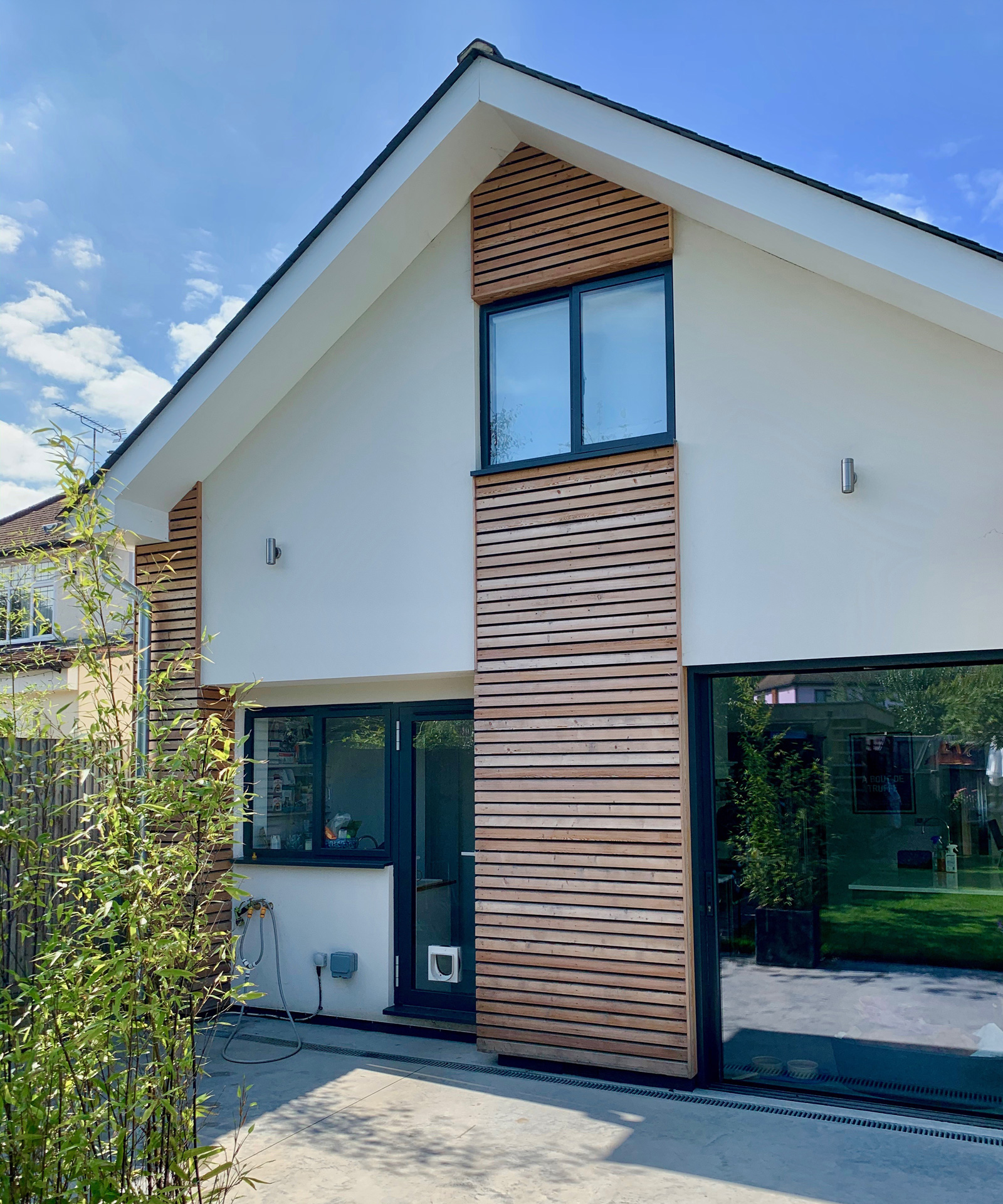 A double-storey side extension and single-storey rear addition introduce generous open-plan living spaces