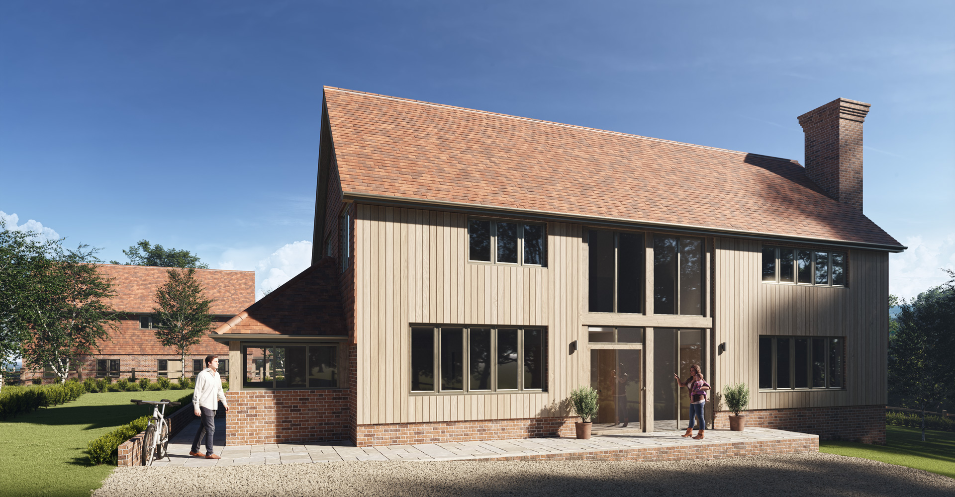The houses are carefully positioned within the plot to retain mature trees, preserve the existing access and maintain the established character of the lane.