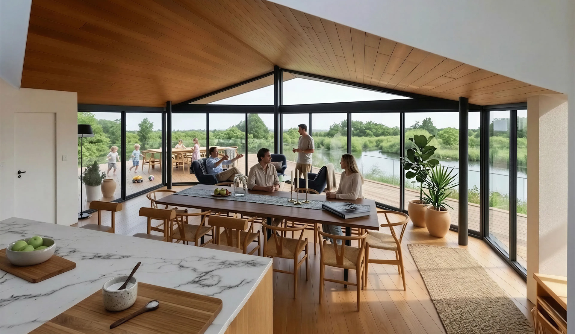 Large sliding glazing allows the kitchen, dining and living spaces to flow naturally onto the terrace, creating a strong connection between the house and its setting.