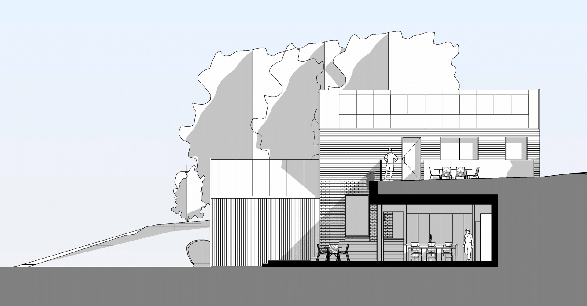Rather than placing a full two-storey building prominently on the plot, the design takes advantage of the site’s natural slope.