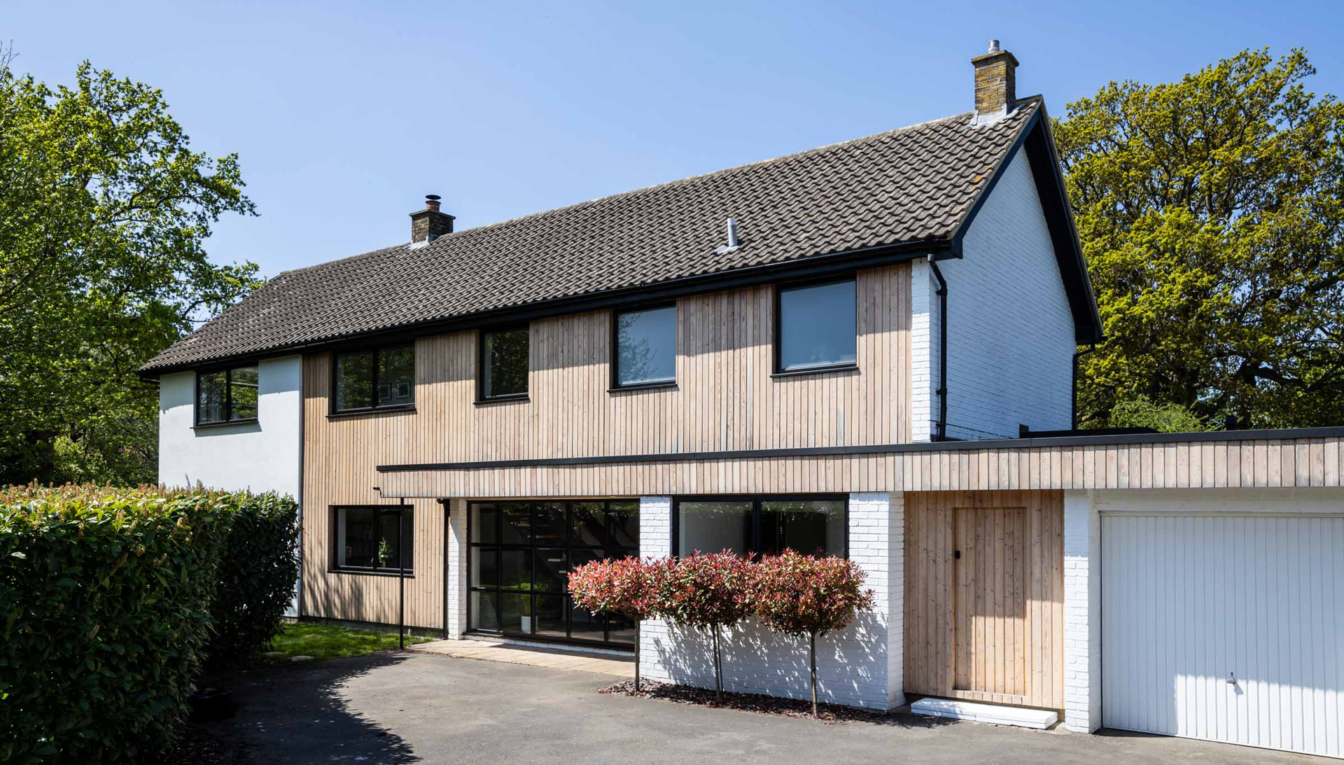 At first floor level, a new extension above the garage rebalances the proportions of the existing house while creating additional bedroom accommodation.