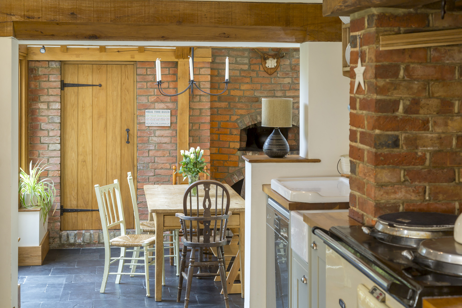 Internally, exposed brickwork, reclaimed timber beams and inglenook fireplaces reinforce the rustic character of the home, while larger openings and improved circulation allow natural light to move more freely throughout the spaces.
