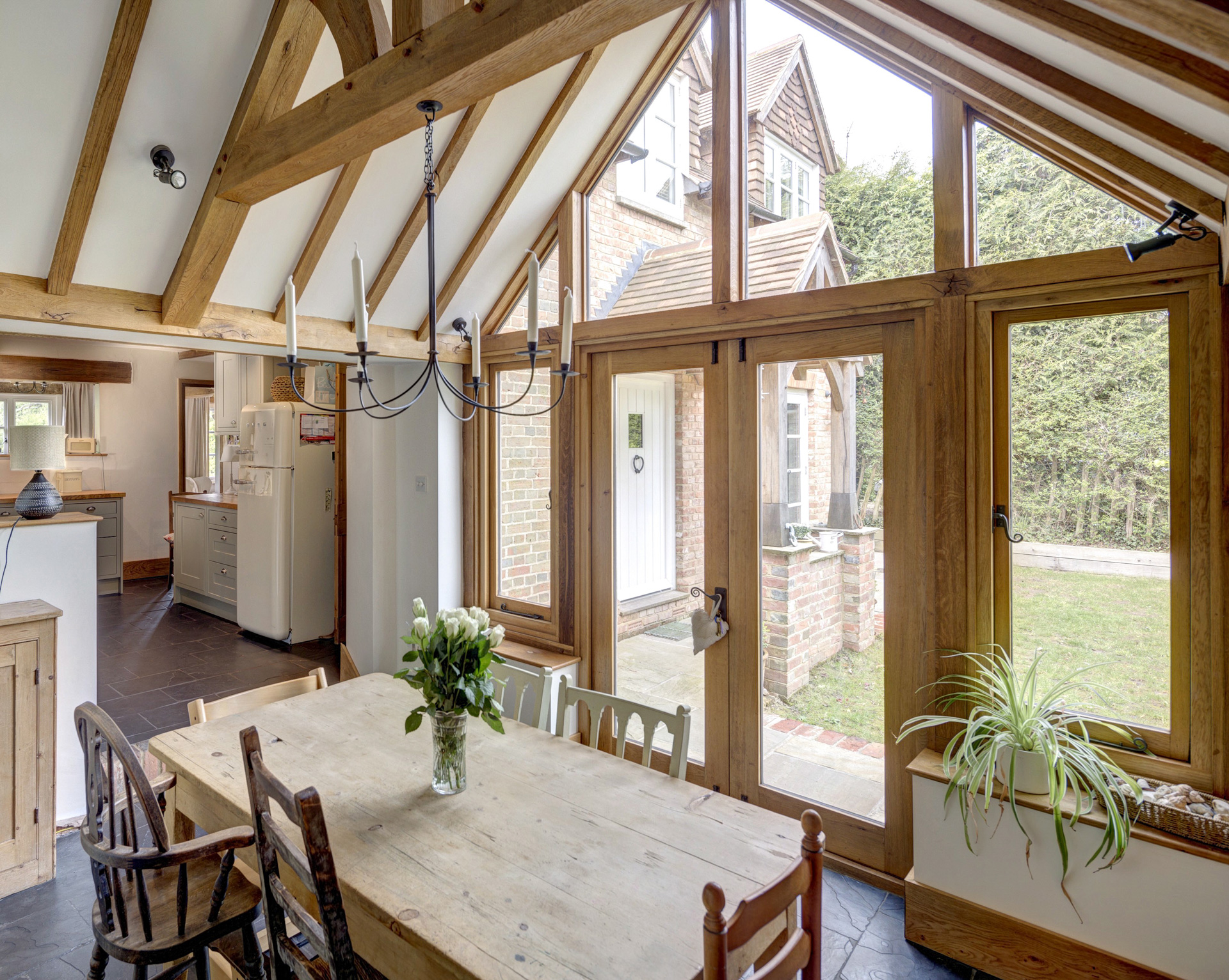 The project transforms the former two-bedroom cottage into a generous four-bedroom family home, balancing traditional architectural language with a more open and connected layout suited to contemporary living.