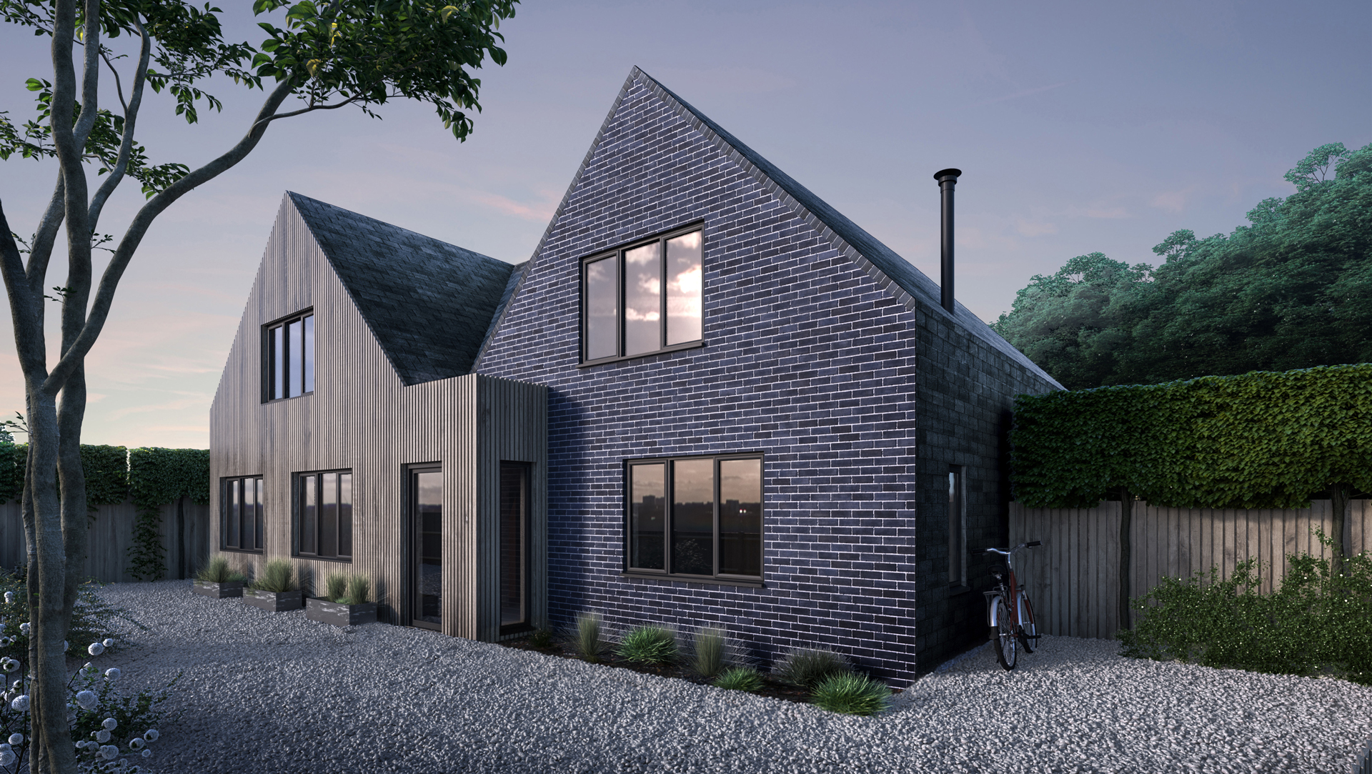The architecture combines a series of simple pitched forms with clean contemporary detailing, creating a composition that feels both modern and rooted within its countryside context