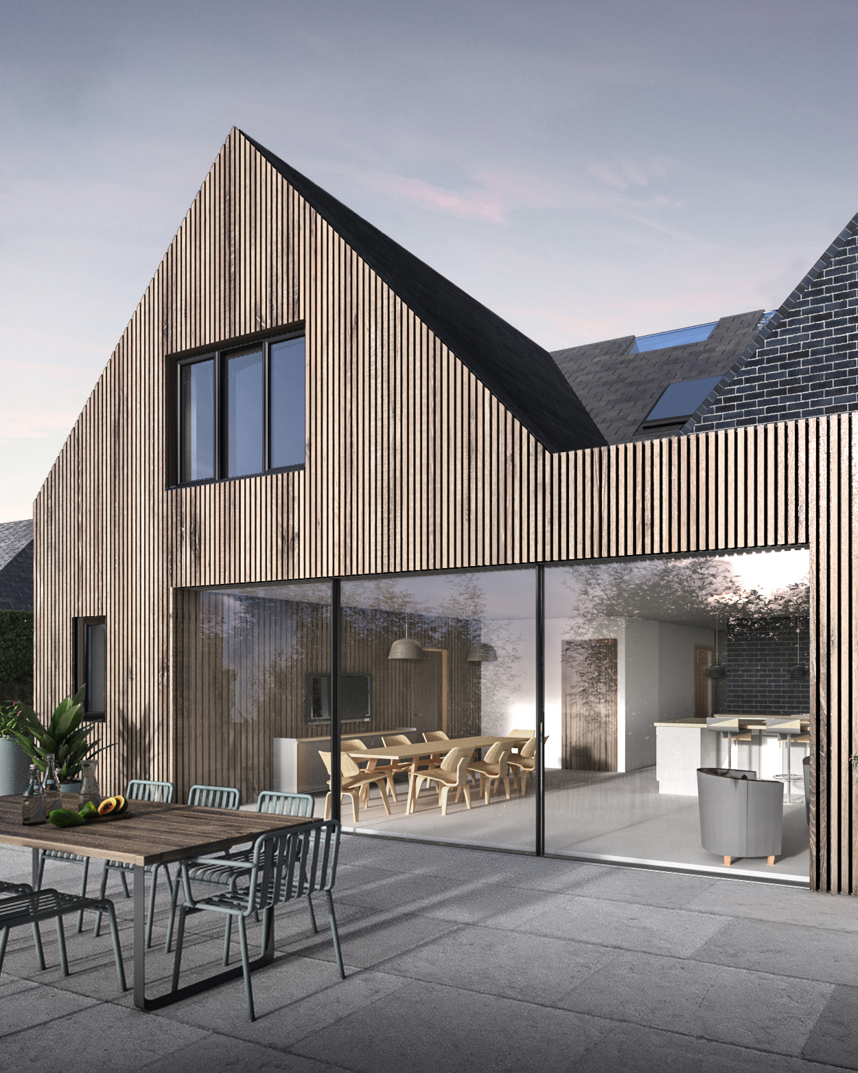 A timber clad and black brick modern pitched roof home.