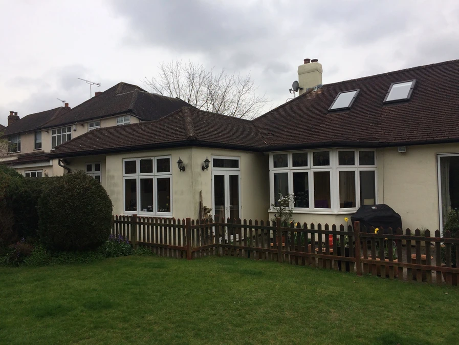 Surrey bungalow conversion and double-storey extension by OSPIN, transforming an existing home with modern architecture, open-plan living and a contemporary white timber-clad exterior.
