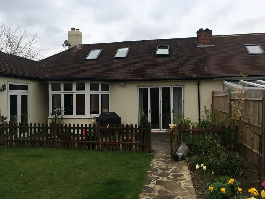 Surrey bungalow conversion and double-storey extension by OSPIN, transforming an existing home with modern architecture, open-plan living and a contemporary white timber-clad exterior.