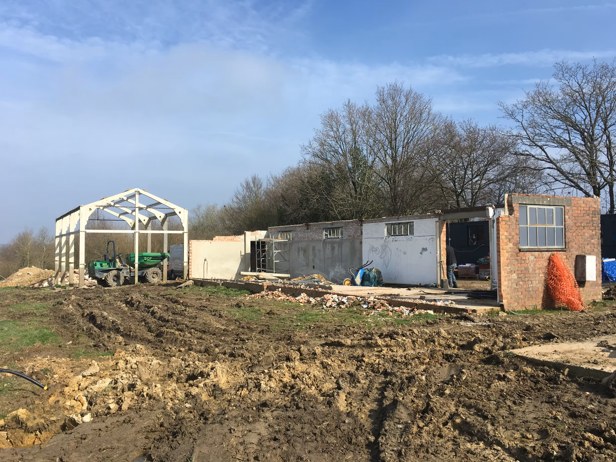 Historic milking shed before restoration as part of a Kent farmstead renovation using reclaimed and traditional building materials.